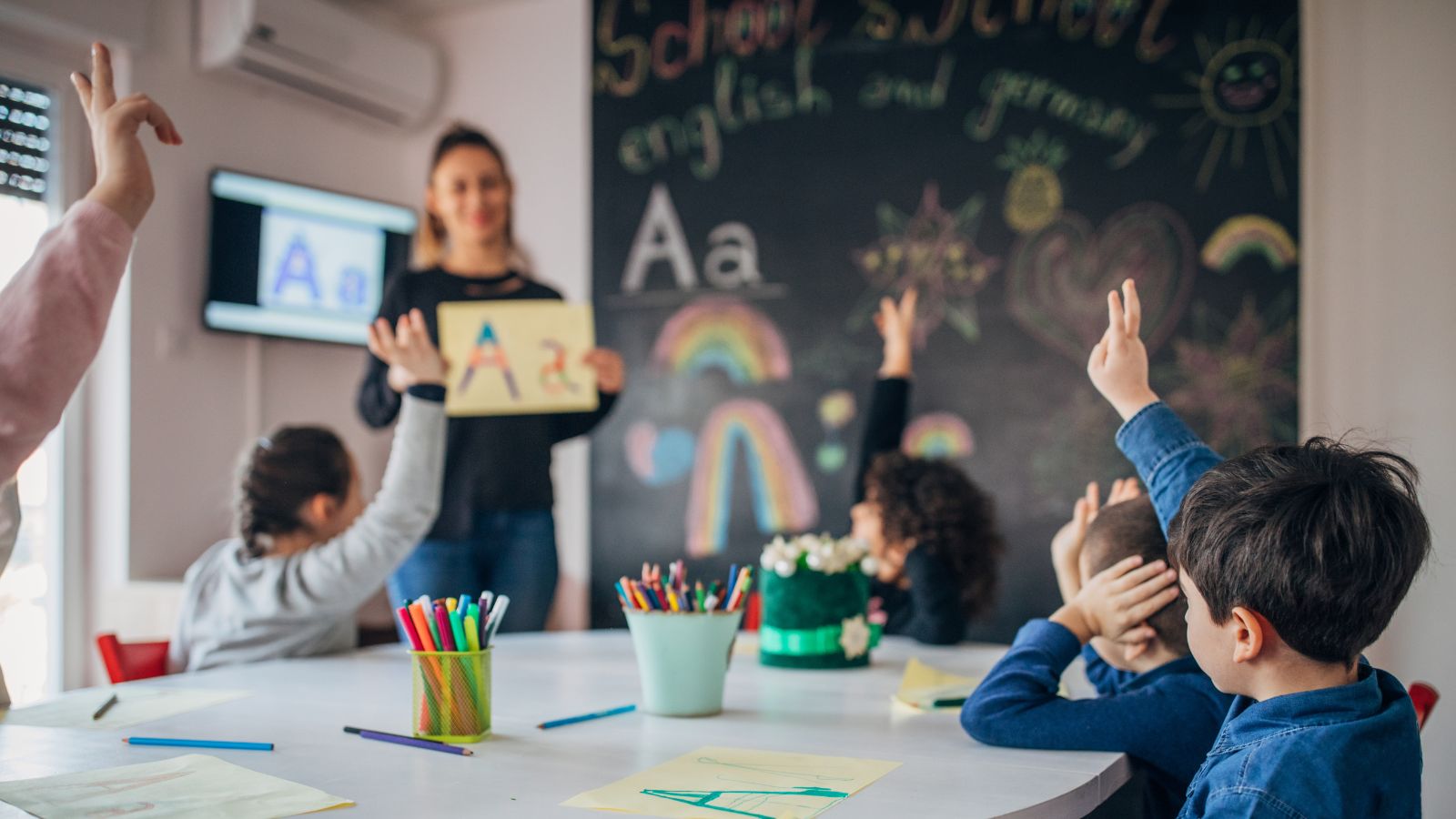 Bilingual classroom teacher leading preschool lesson at Little Tree Montessori NYC